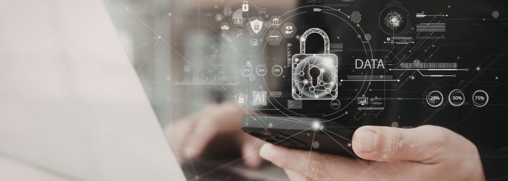 Close-up of hands holding a smartphone with digital security graphics and a padlock, symbolizing data protection and cybersecurity.
